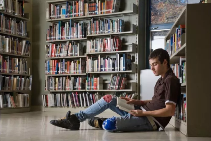 Teenboy reading book