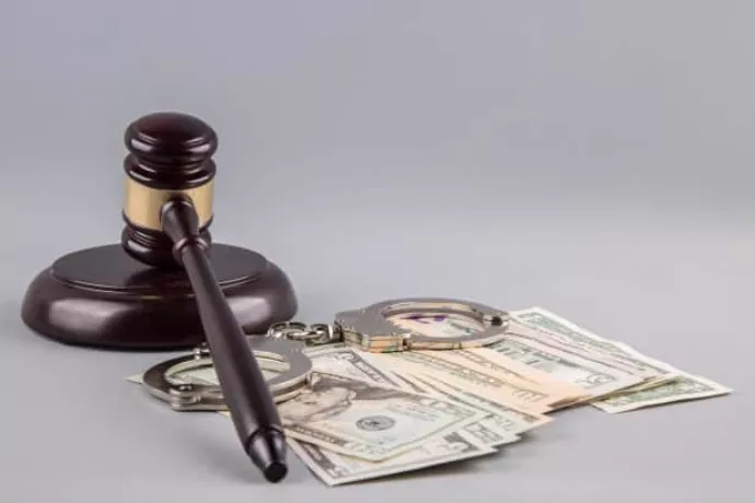 judge-gavel-with-money-and-handcuf-14612880091Is